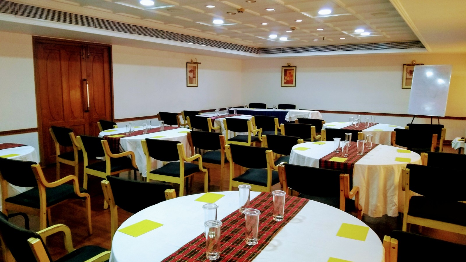 Meeting and banquet space set with round tables at Abad Atrium