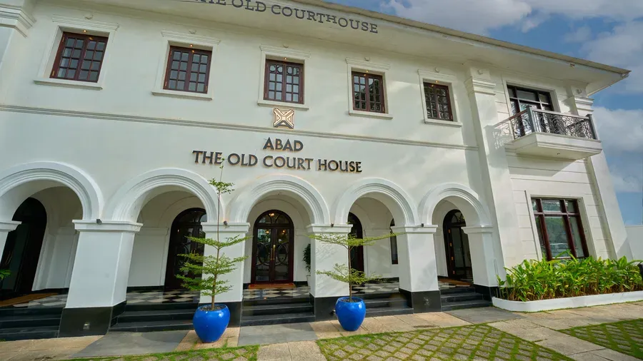 Arcaded white facade of The Old Court House by Abad in Fort Kochi