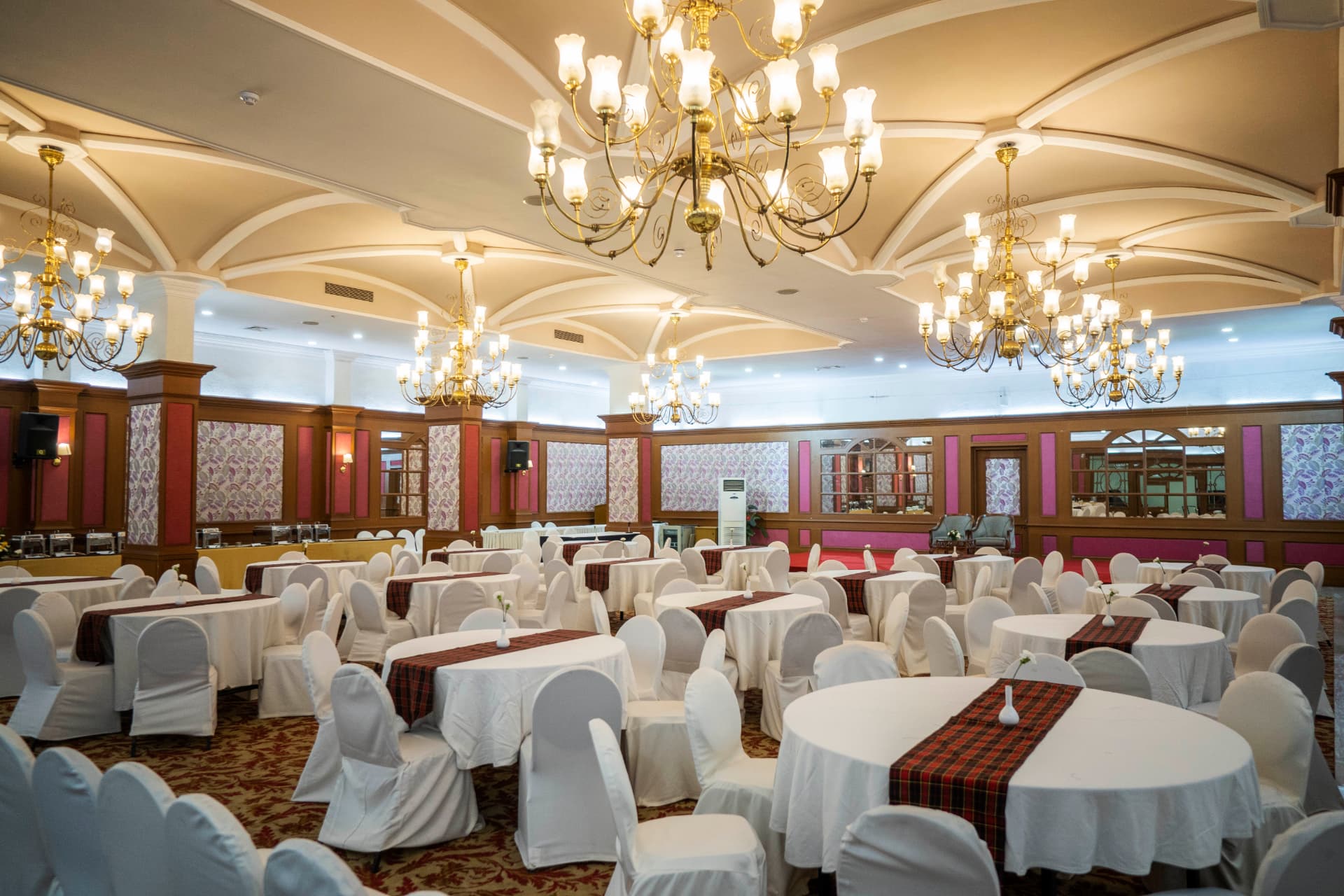 The Regency banquet dining room with chandeliers and formal table settings