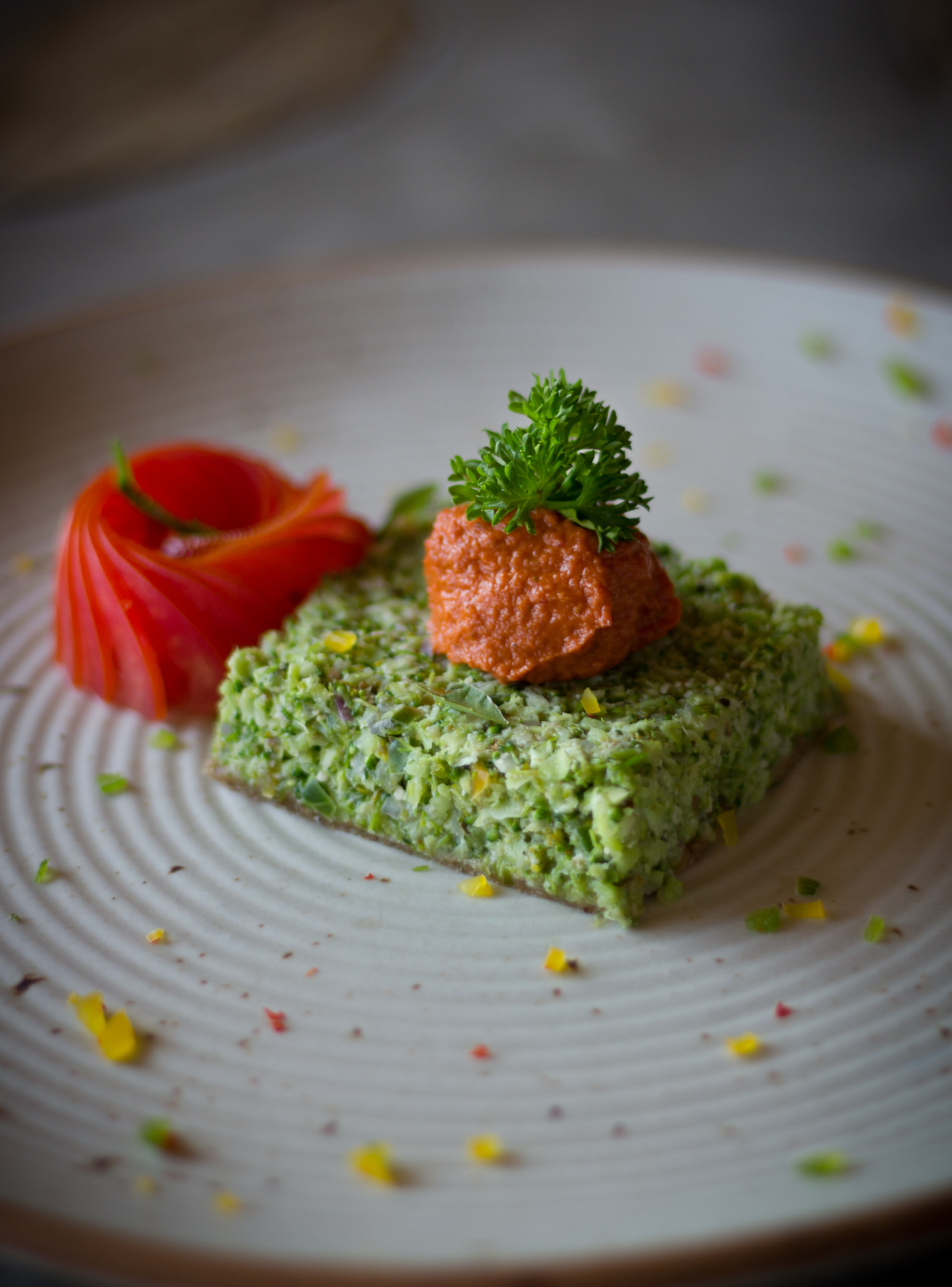 Raw plant-based dish of finely chopped greens with a red pepper relish, Prakriti Shakti Kerala