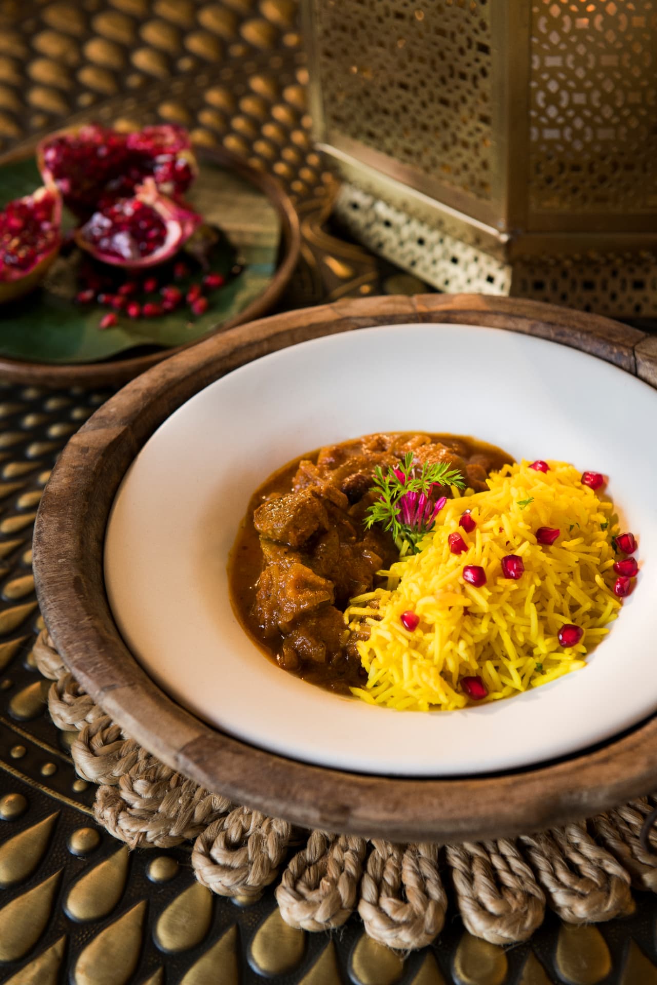 Slow-cooked curry with saffron rice and pomegranate — Aramness Gir, Gujarat