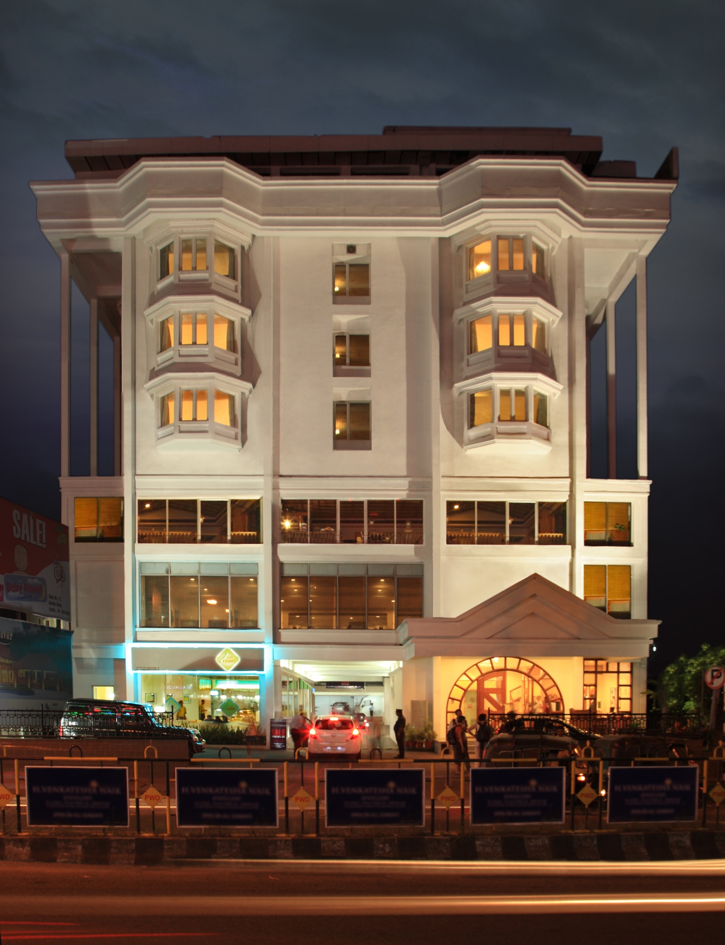 Abad Plaza illuminated exterior at night, MG Road Kochi