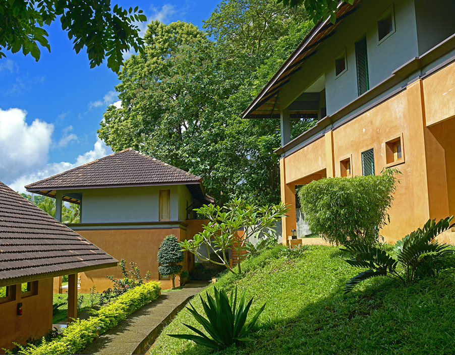 Cottages and gardens in daylight – Abad Green Forest, Thekkady