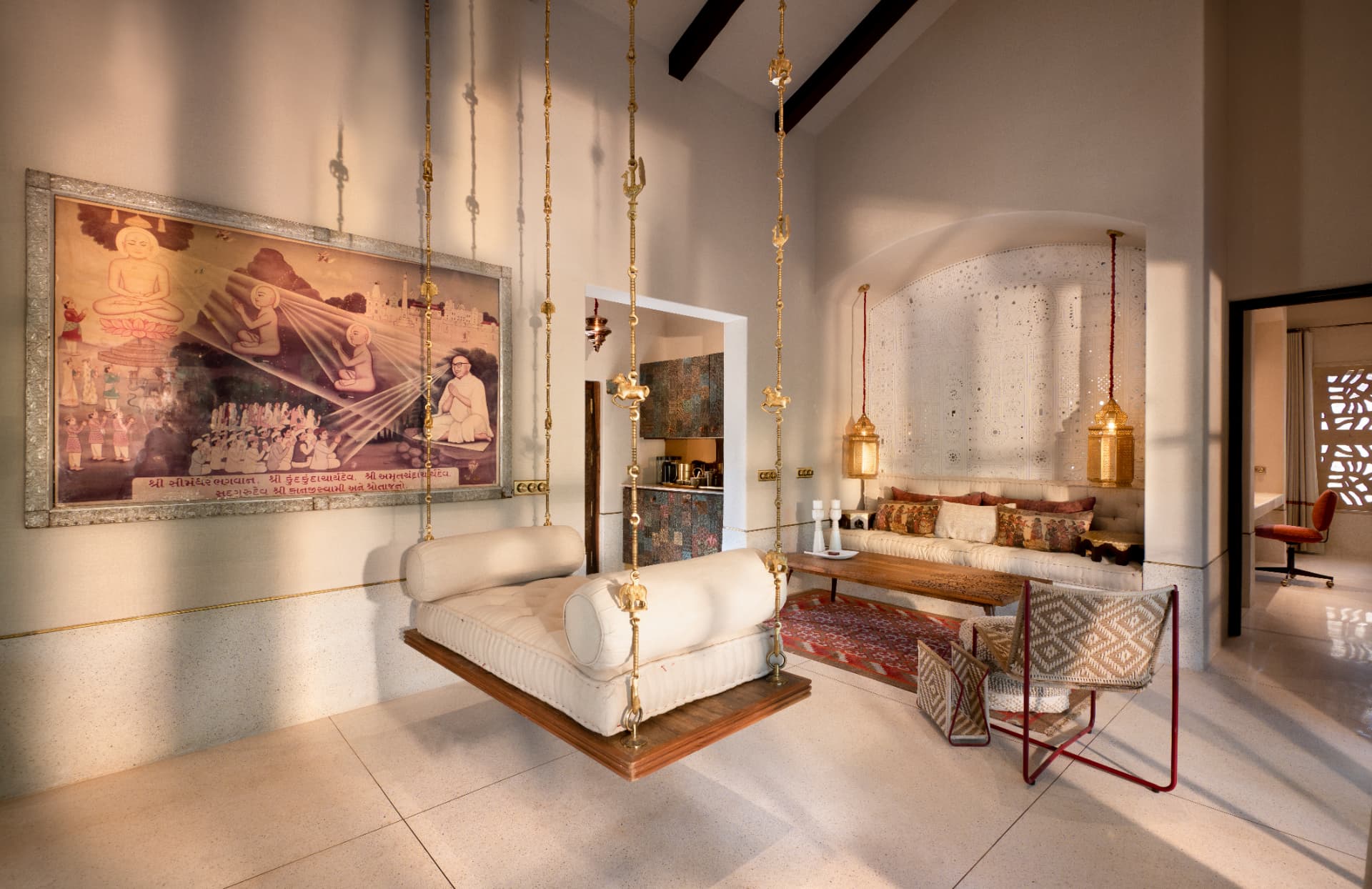 Kothi living room with brass hindolo swing — Aramness Gir, Gujarat