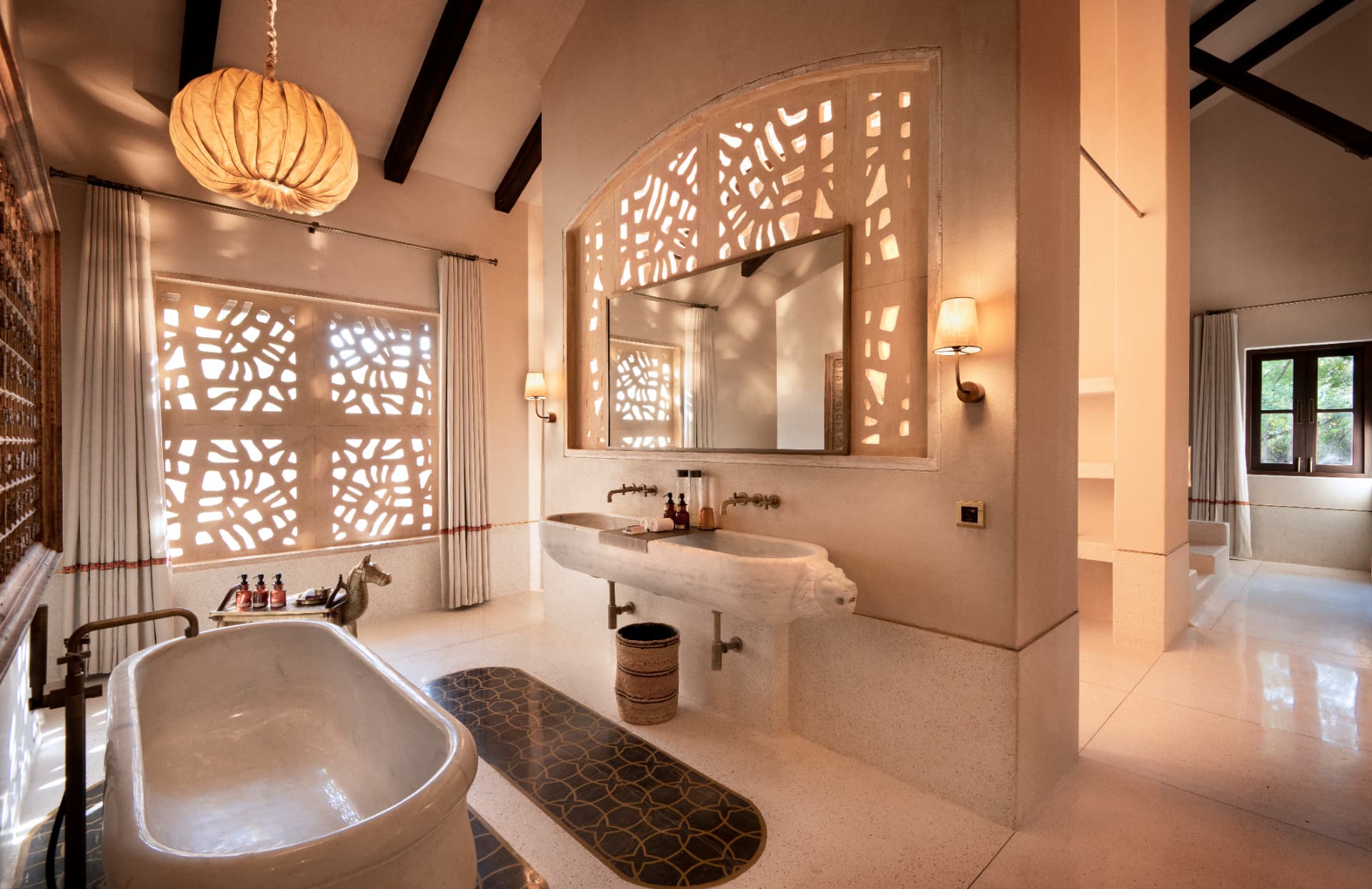 Marble bathtub behind carved jali — Aramness Gir, Gujarat