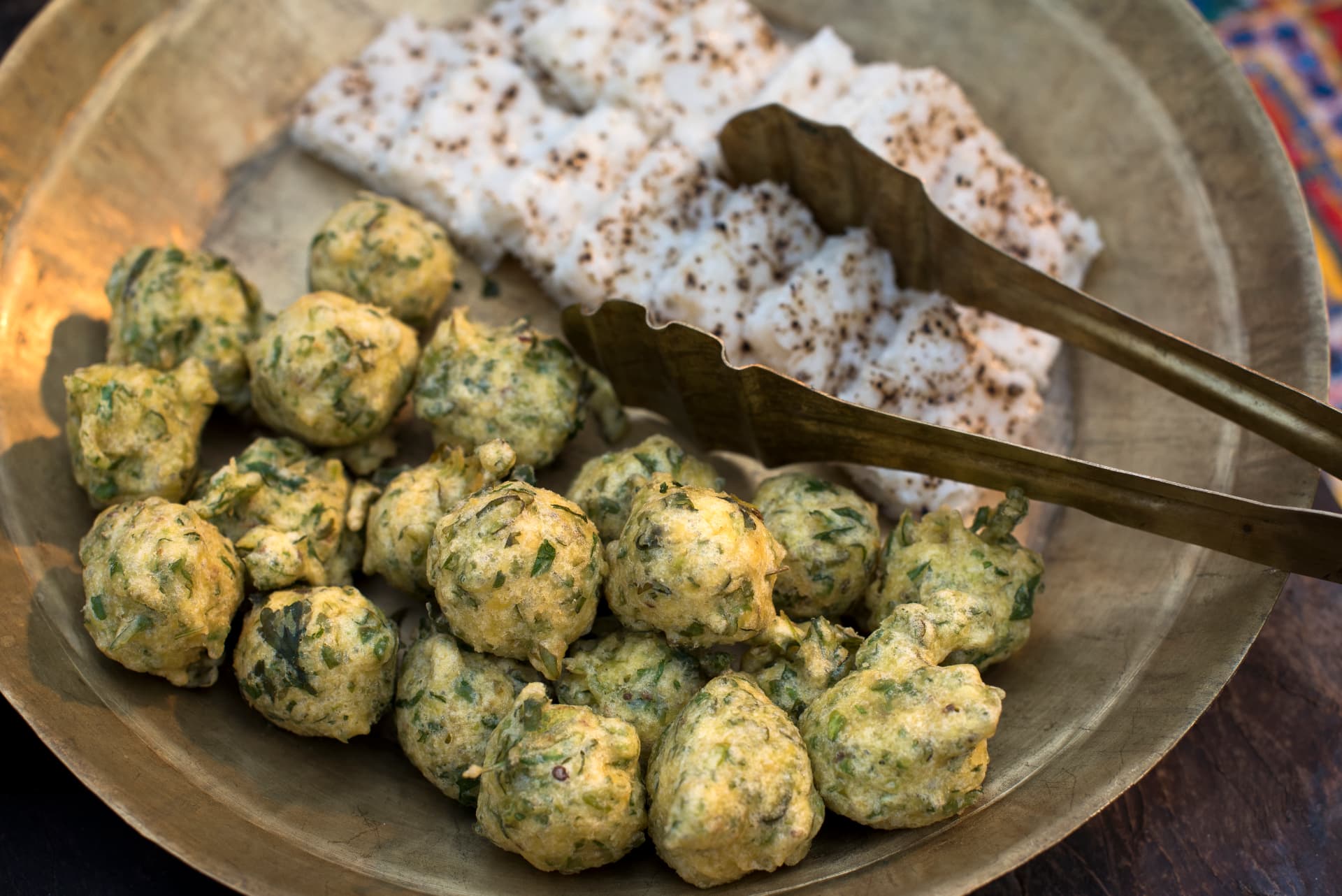 Methi gota and khakhra on hand-beaten brass