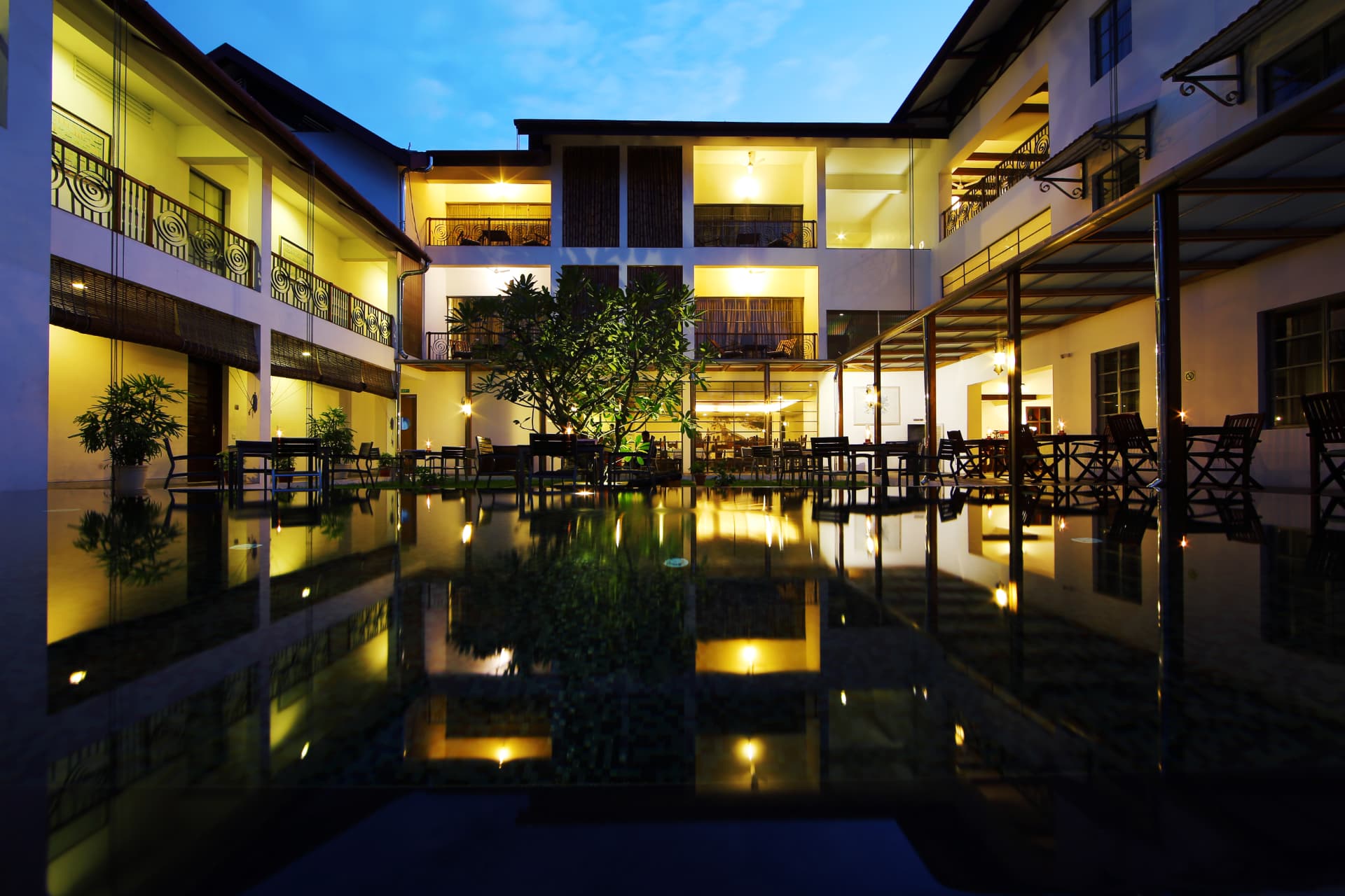 Illuminated courtyard and reflecting pool at Eighth Bastion, Fort Kochi