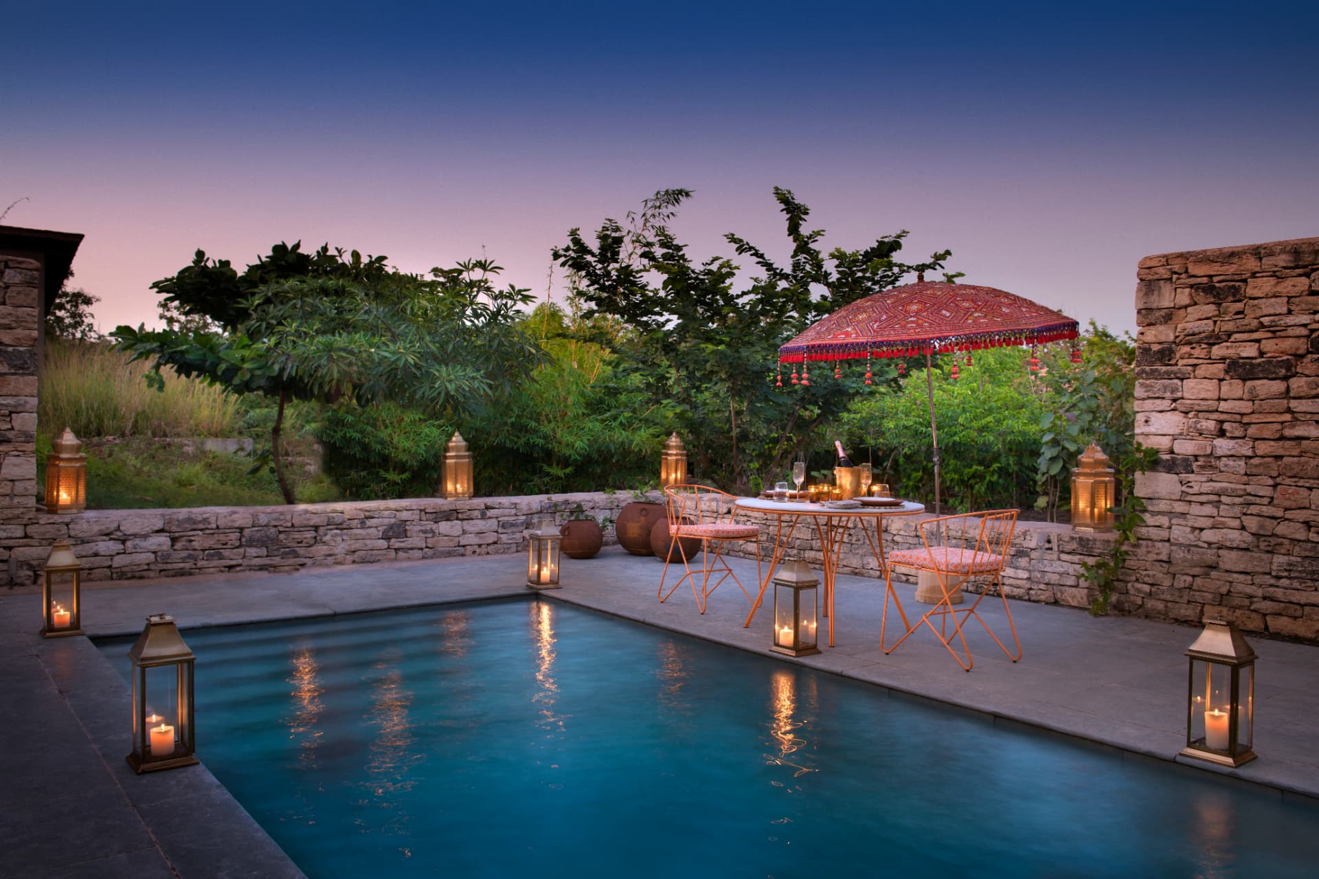 Lantern-lit dinner beside a private pool