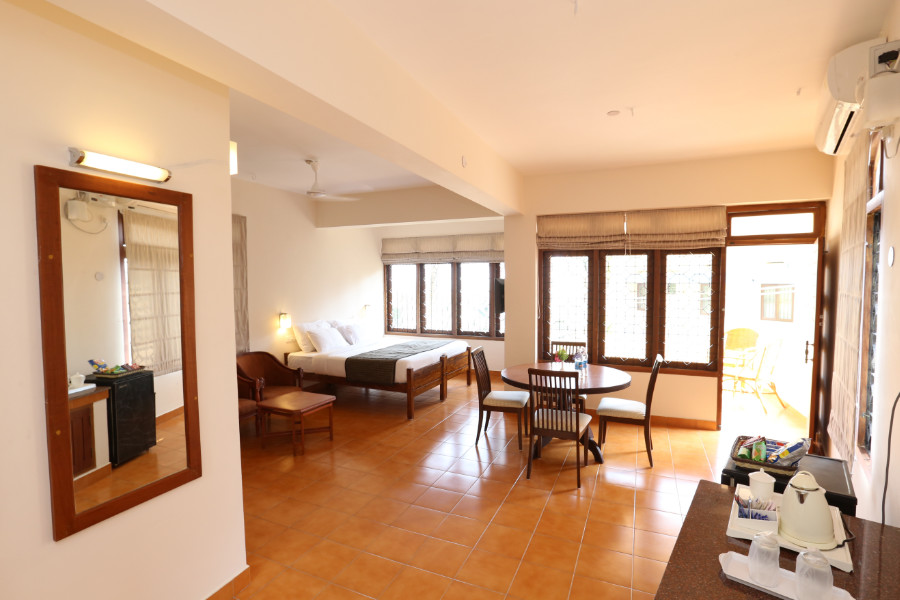 Superior Room at Abad Serviced Villas with bedroom, dining area and balcony