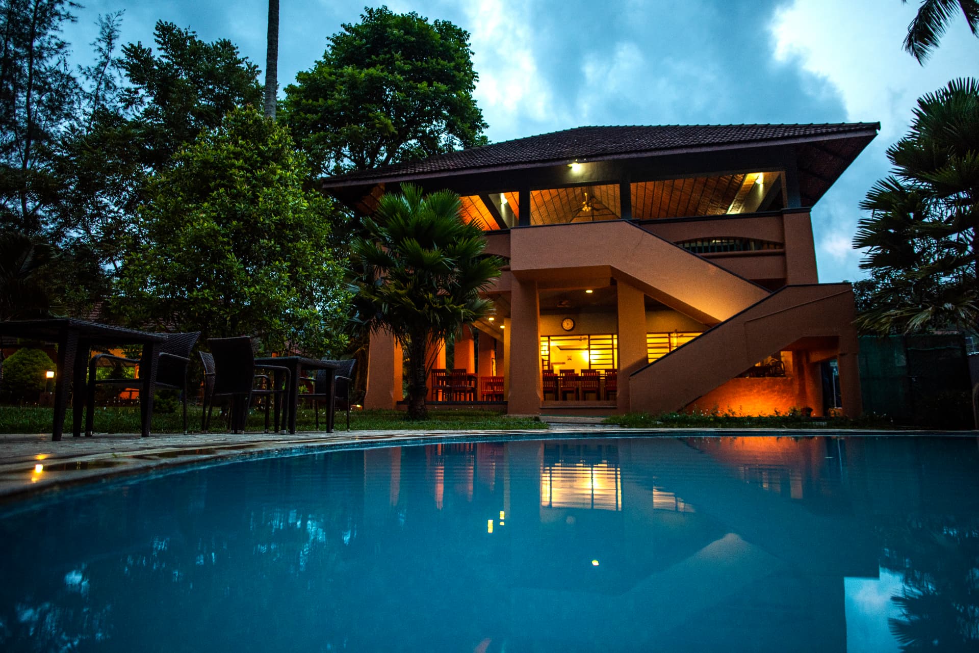 Pavilion reflected in the pool – Abad Green Forest, Thekkady