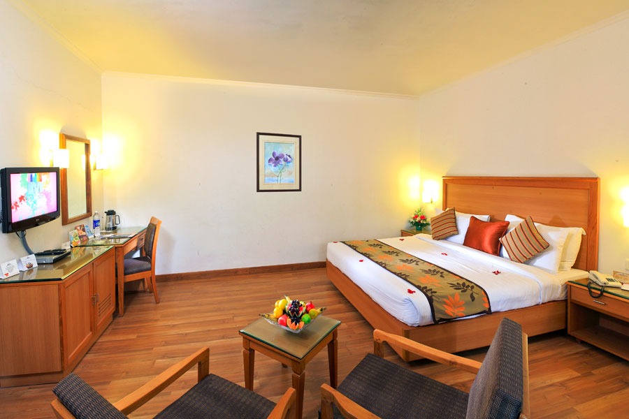 Superior Room with king-size bed and seating corner