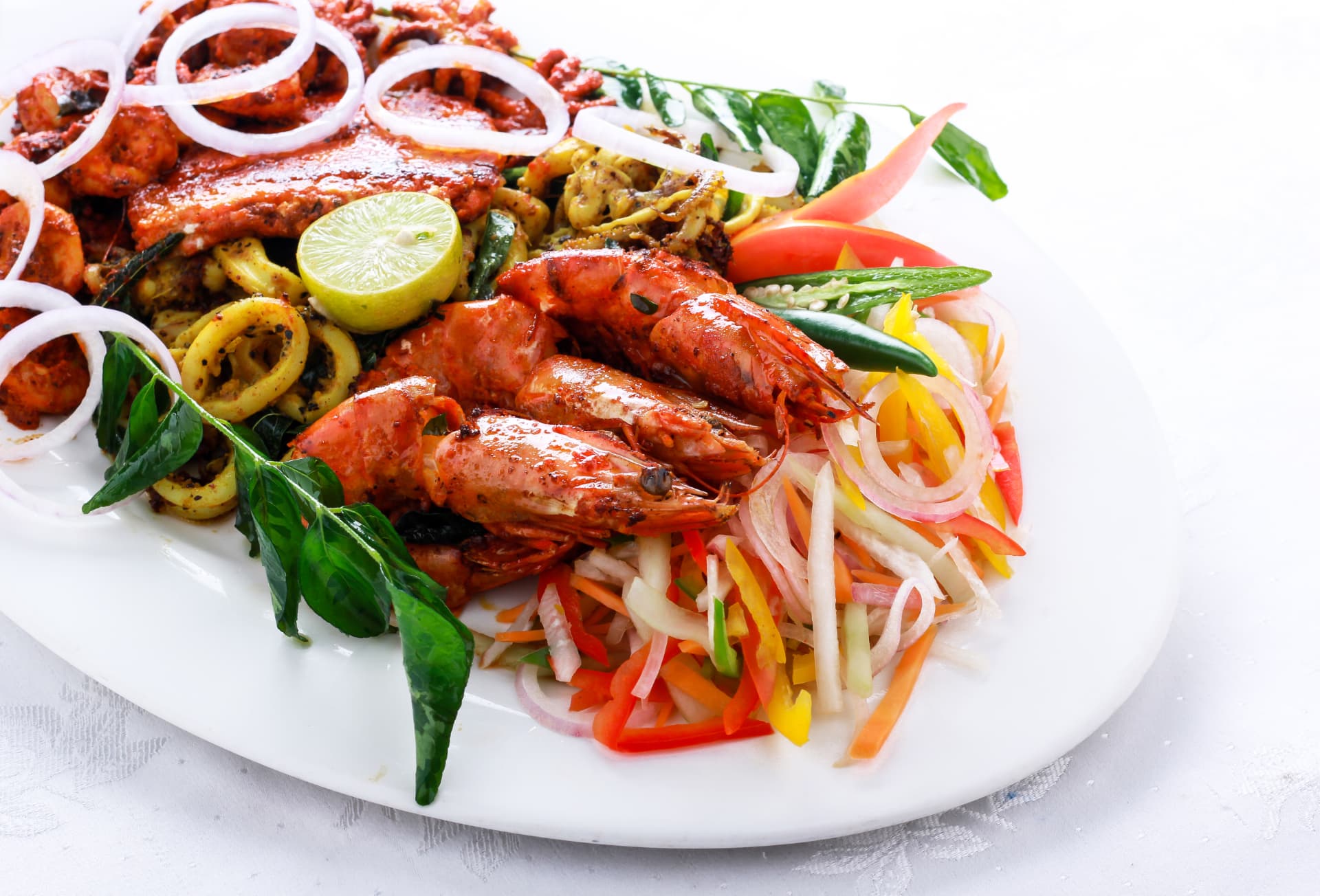 Tandoori prawns and squid with onion salad