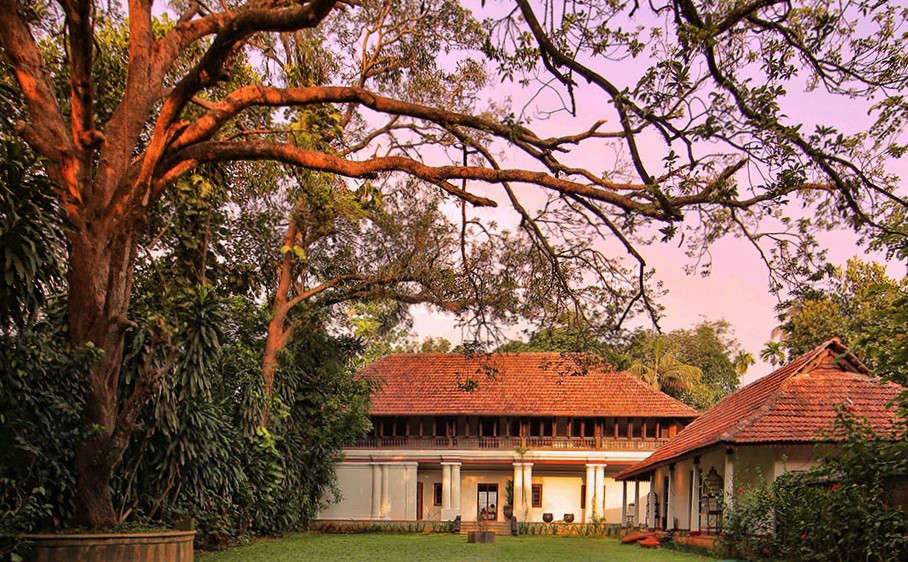 Chittoor Kottaram royal heritage residence beneath a rain tree near Ernakulam