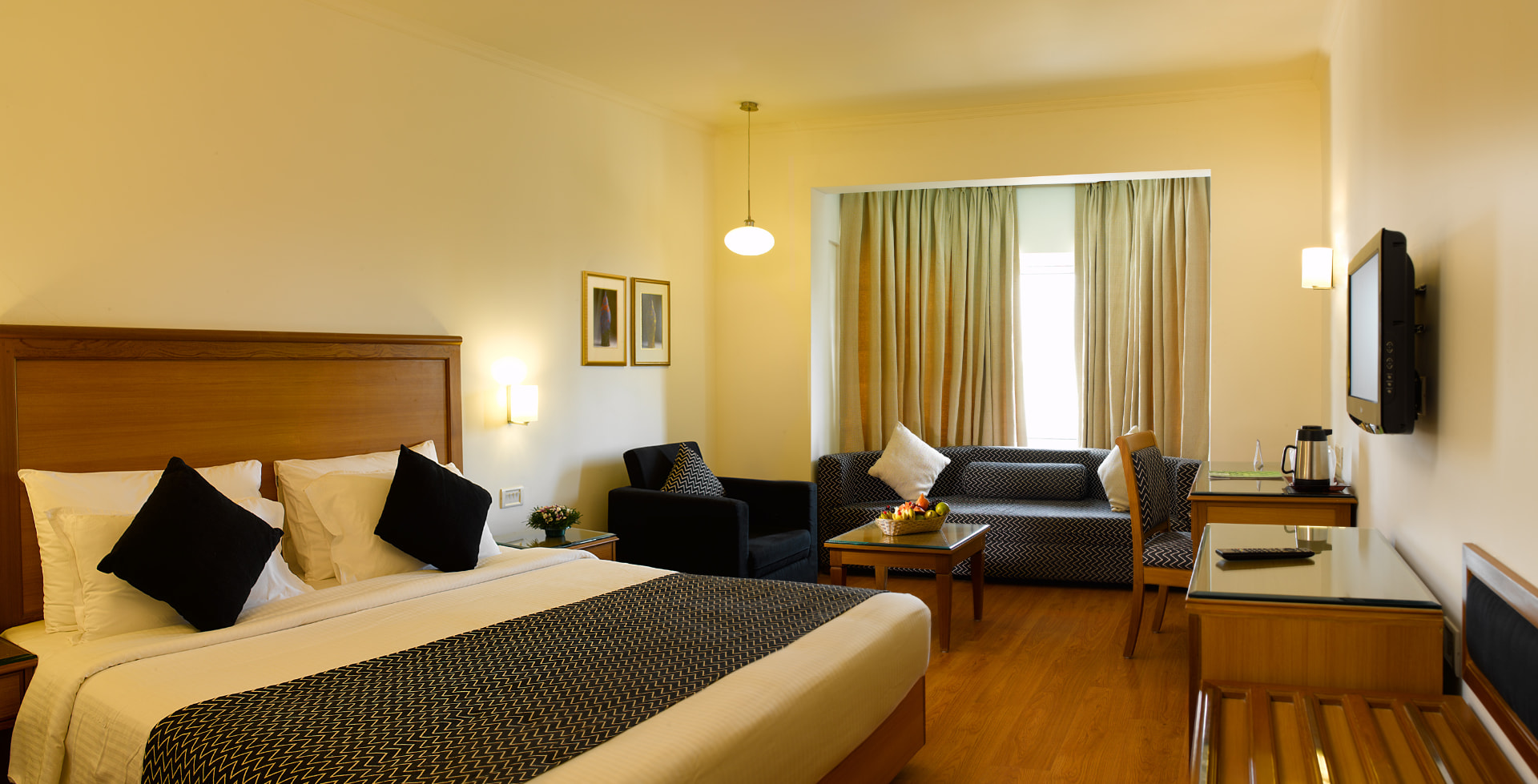 Superior room with wood panelling and patterned bedspread