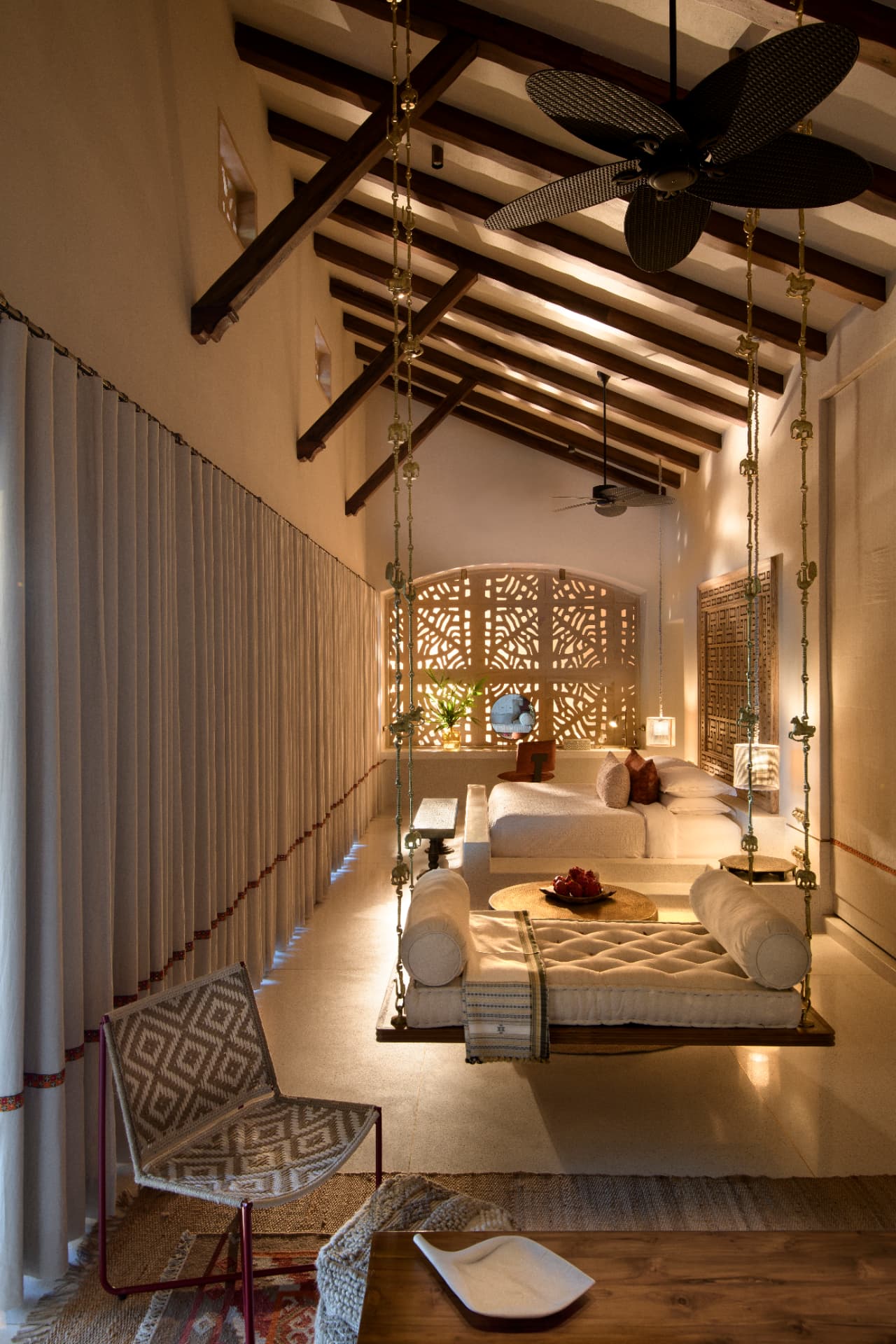 Bedroom with swinging daybed — Aramness Gir, Gujarat