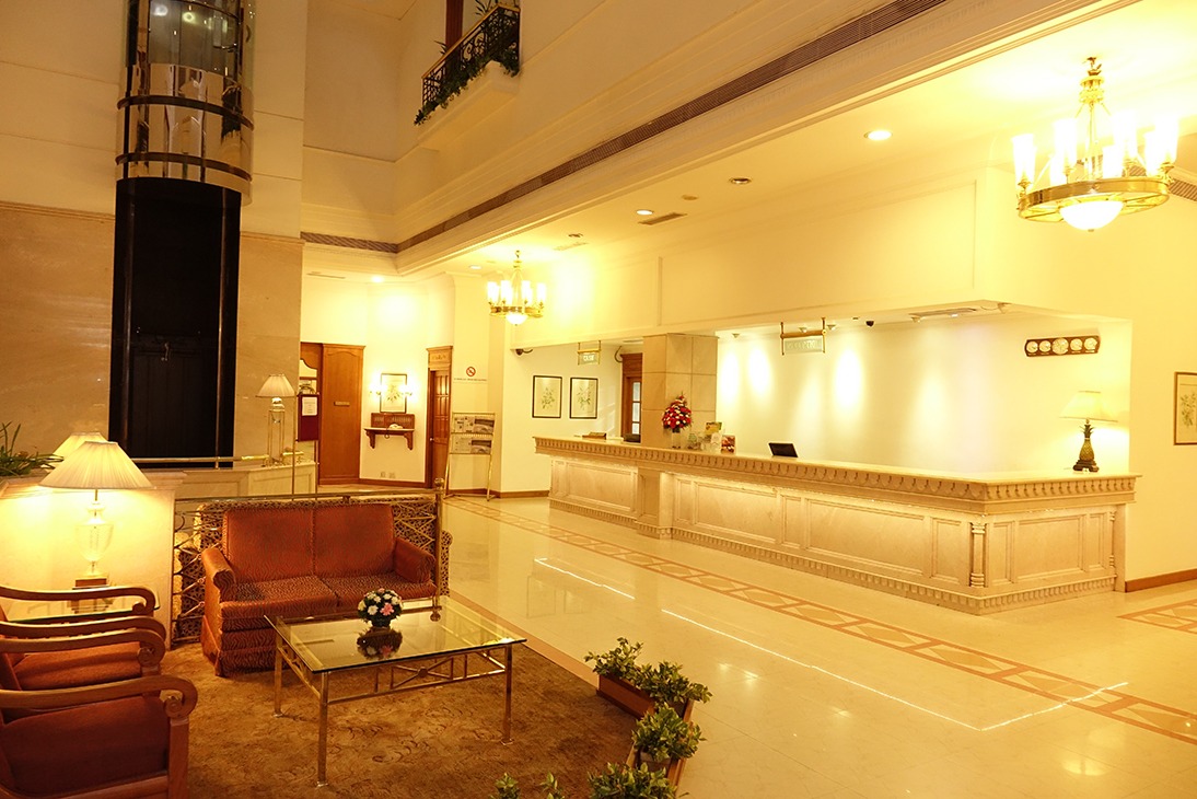 Reception desk and lobby lounge at Abad Atrium