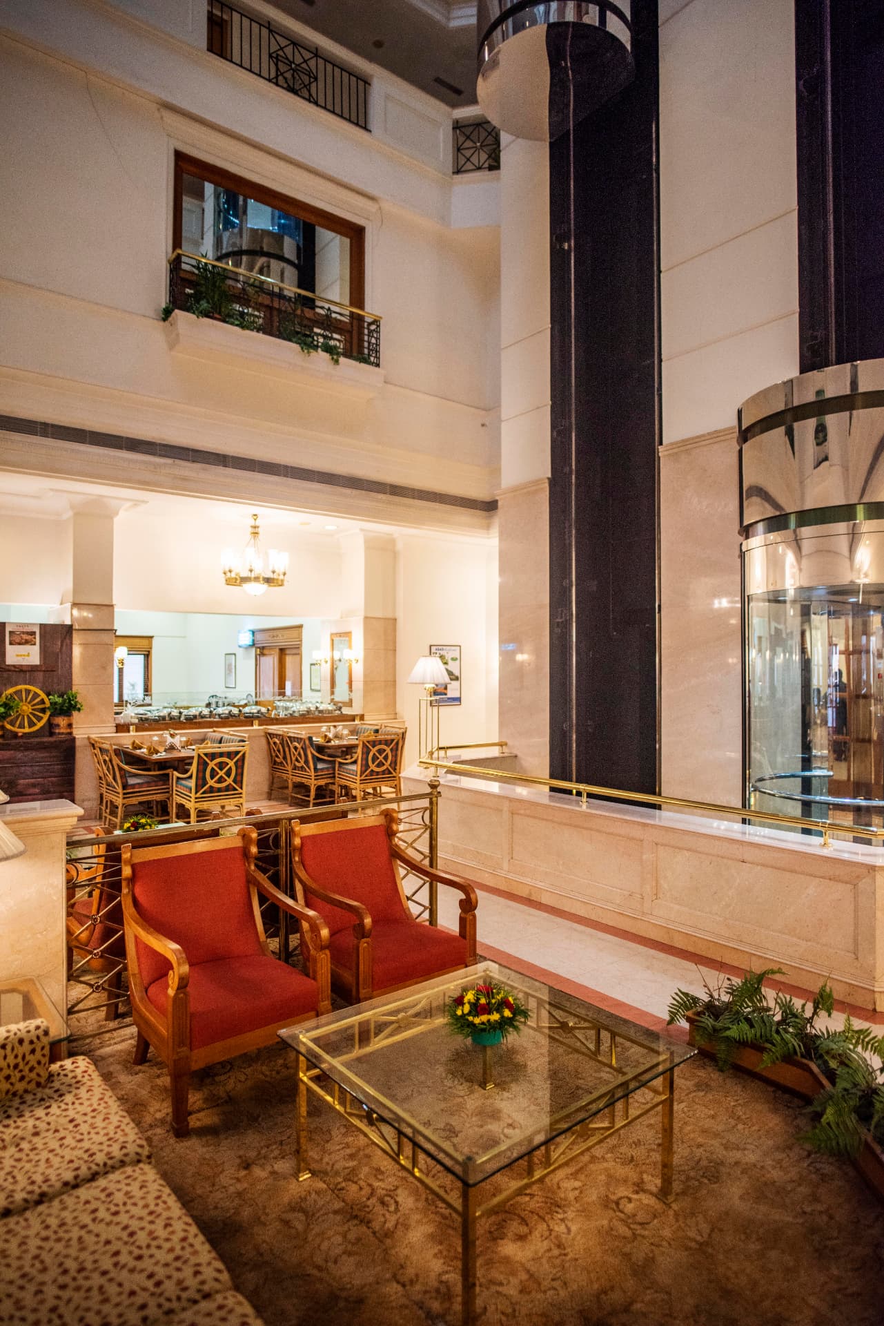 Lobby lounge seating beside the atrium and restaurant