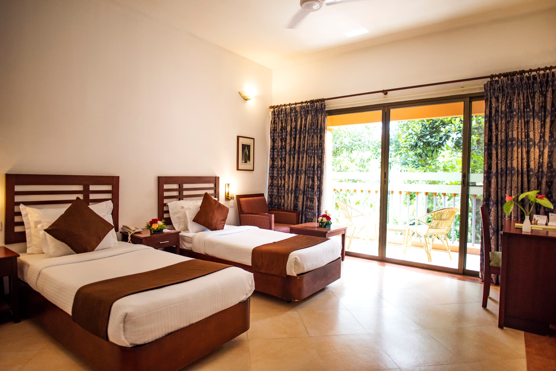 Twin room with cane balcony seating – Abad Green Forest, Thekkady