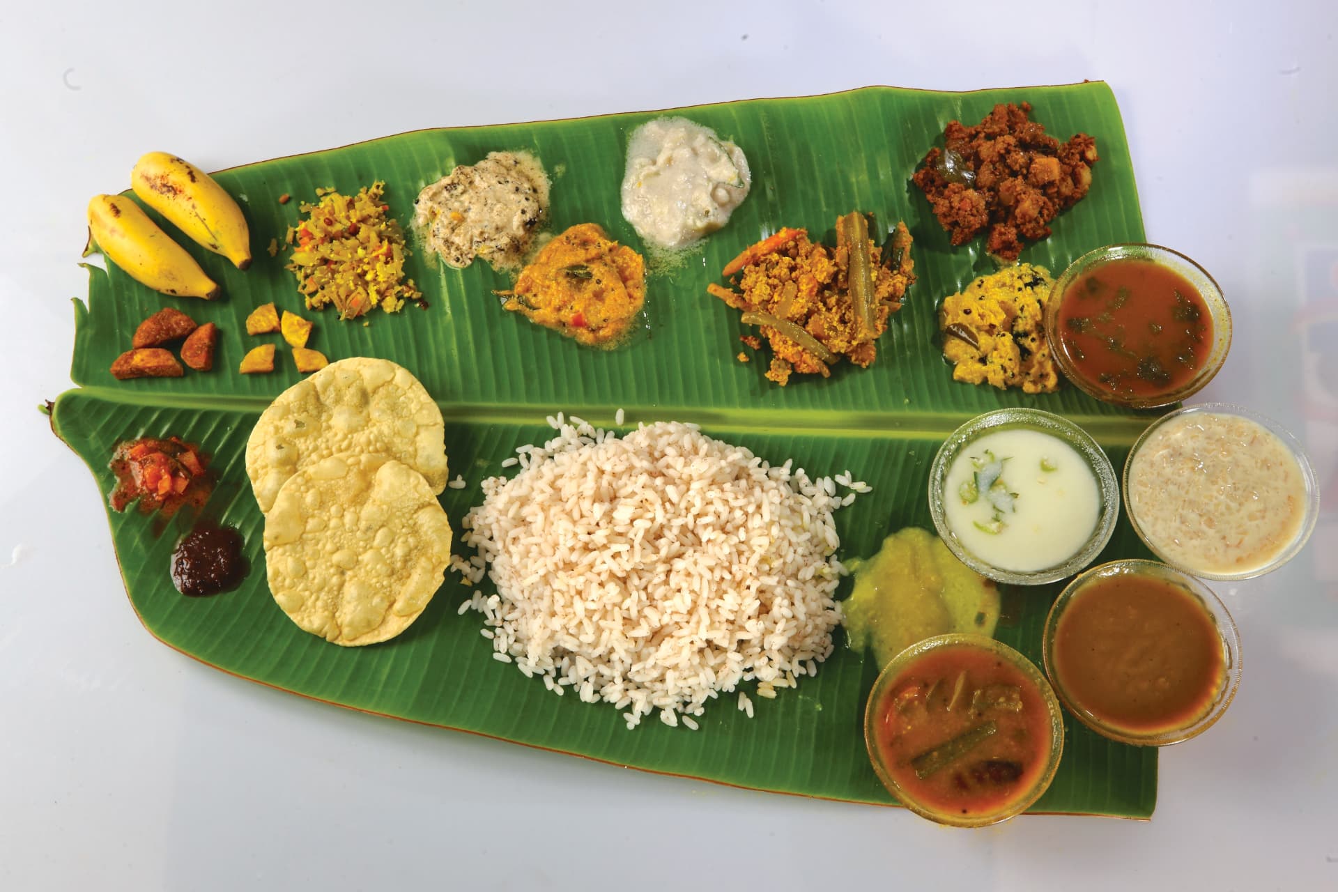 Kerala sadya on a banana leaf at Abad Fort