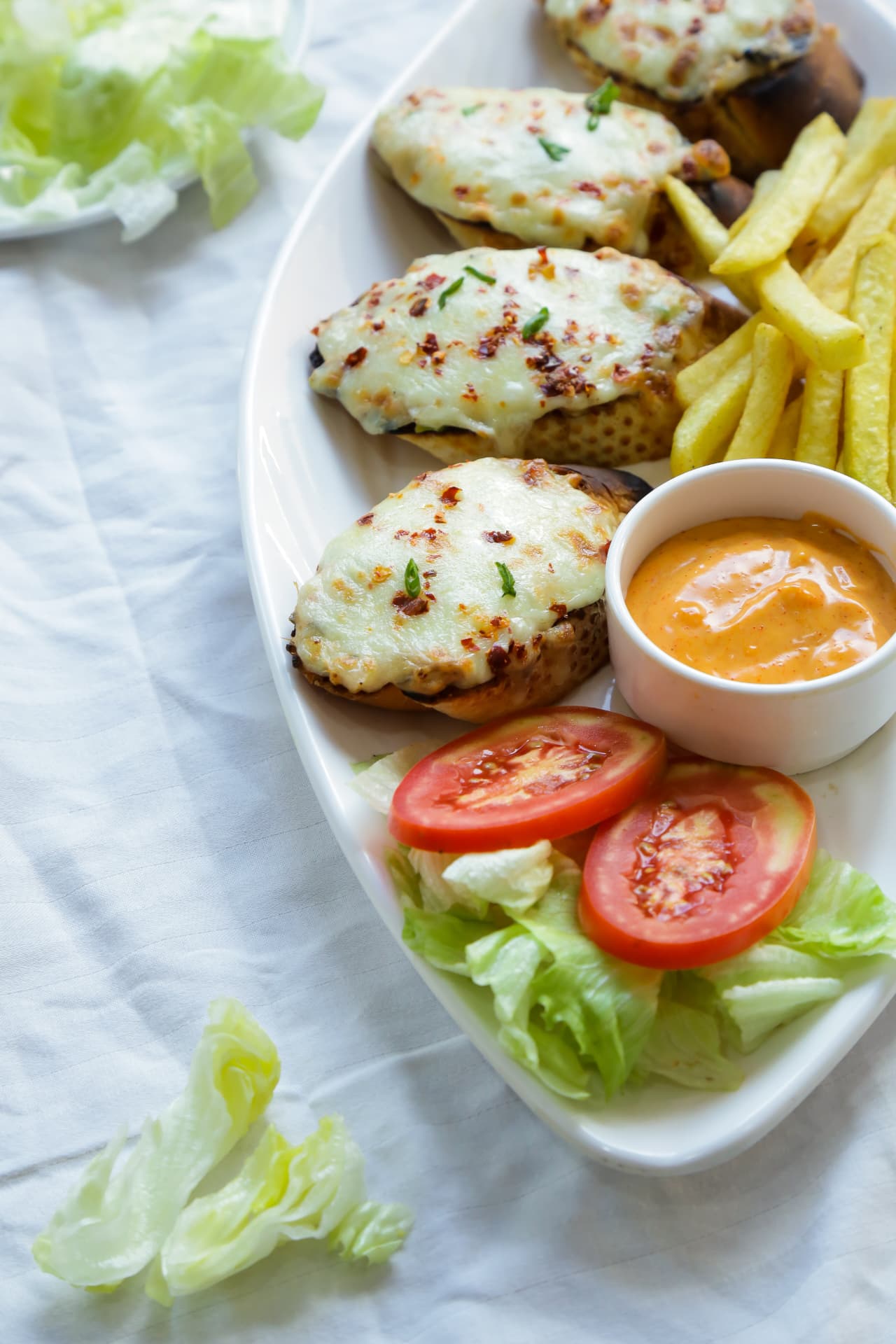 Cheese toast platter with fries and salad at Abad Fort