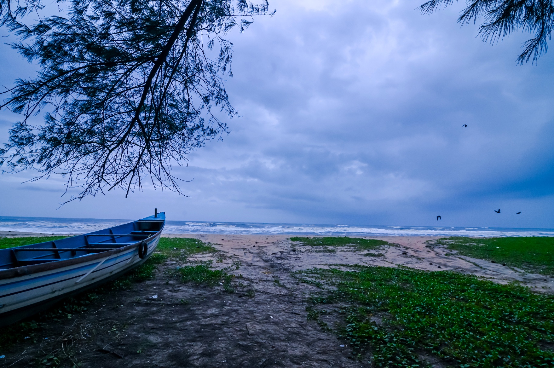 Fishing boat on Nattika beach at dusk
